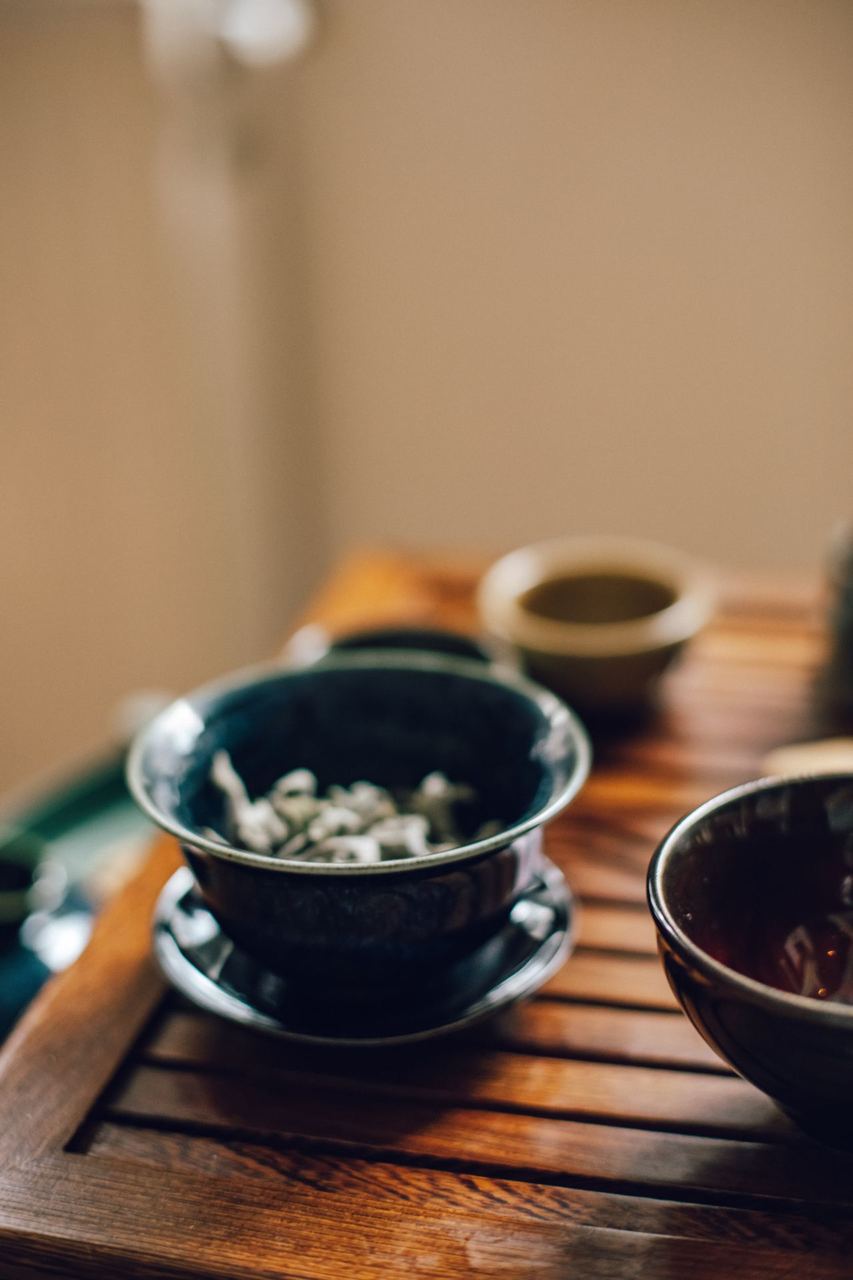 A bowl of gaiwan tea, brewed in a lidded cup