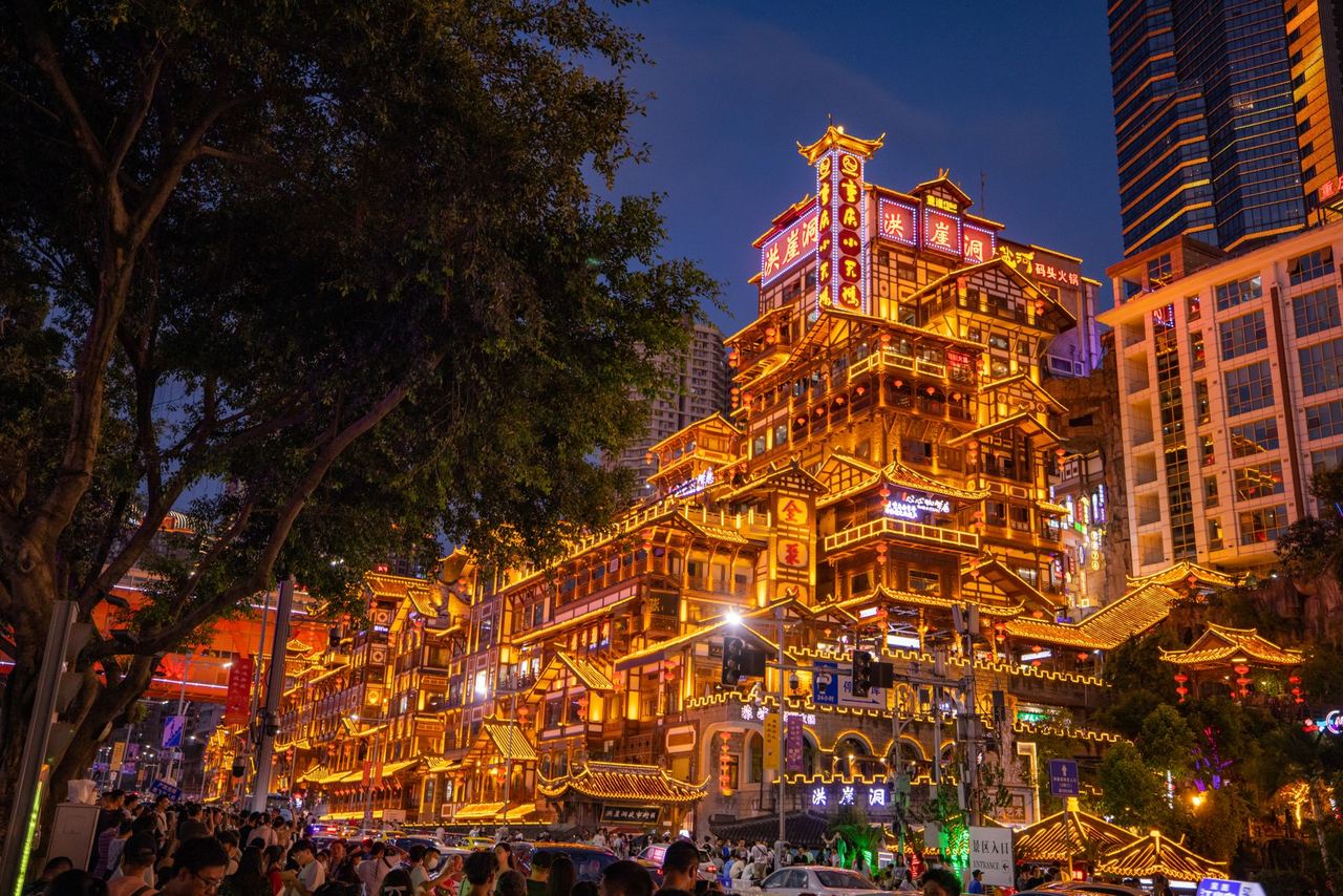 Hongyadong’s stilt houses glowing against the Jialing River
