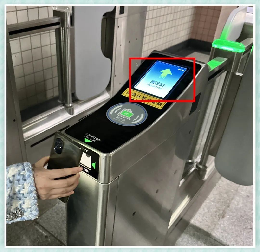 A metro gate with its QR-code scanner